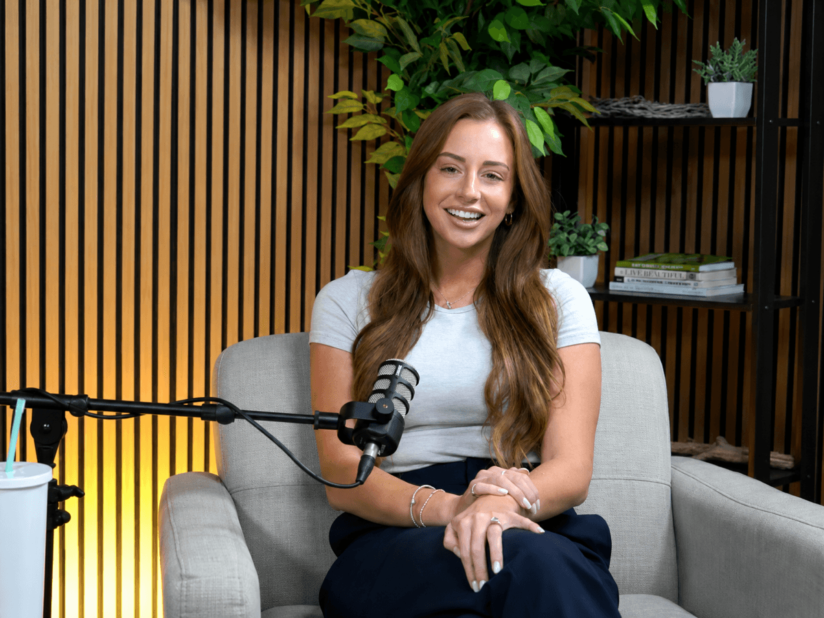 Podcaster recording with a microphone in JPR's Dallas studio