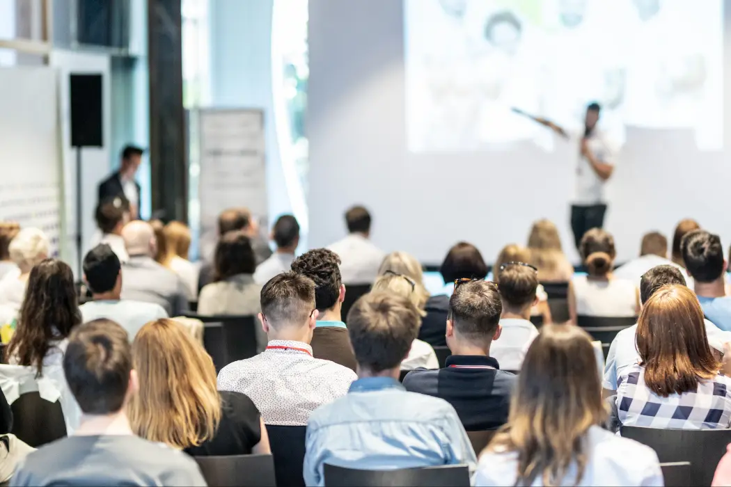 Conference audience watching a live session